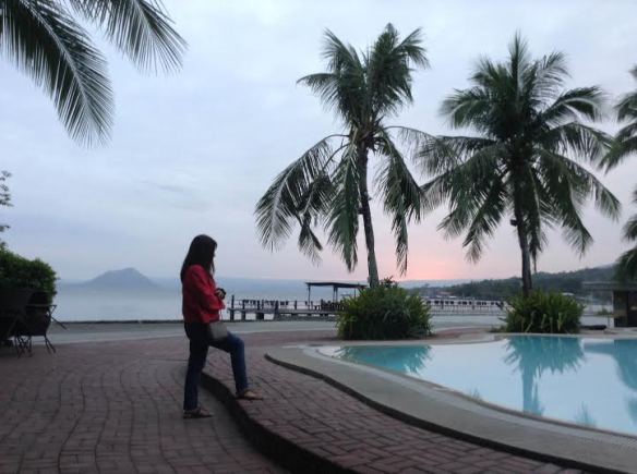 This is one of my favorite shots. My cousin was standing by the pool at dusk, with the Taal Volcano as backdrop